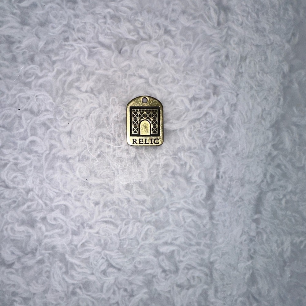 Relic Gold Emblem bag charm